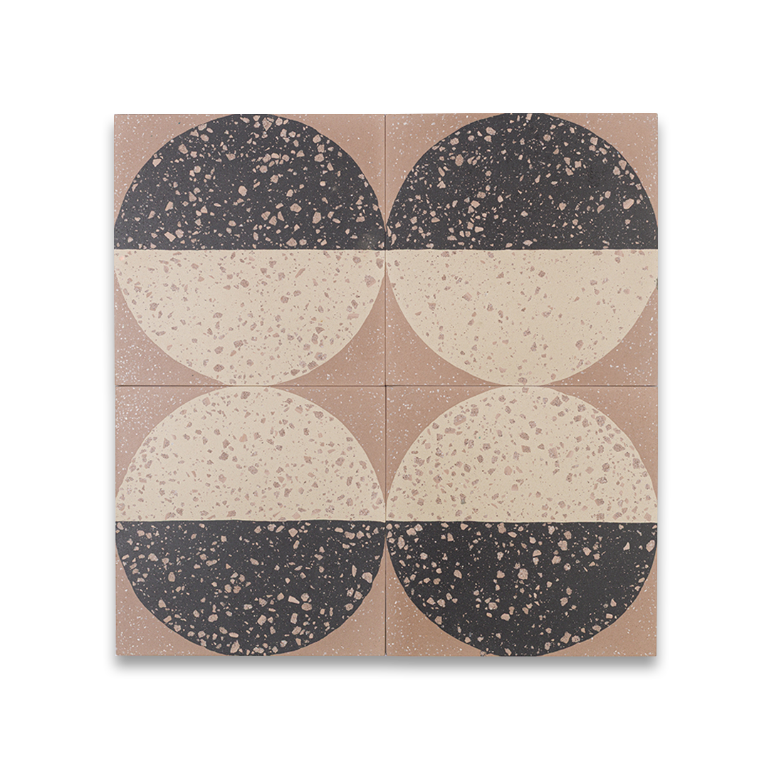 A square cement tile featuring a large circle divided into black and beige halves with terrazzo speckles, set against a warm brown background for a modern geometric look.