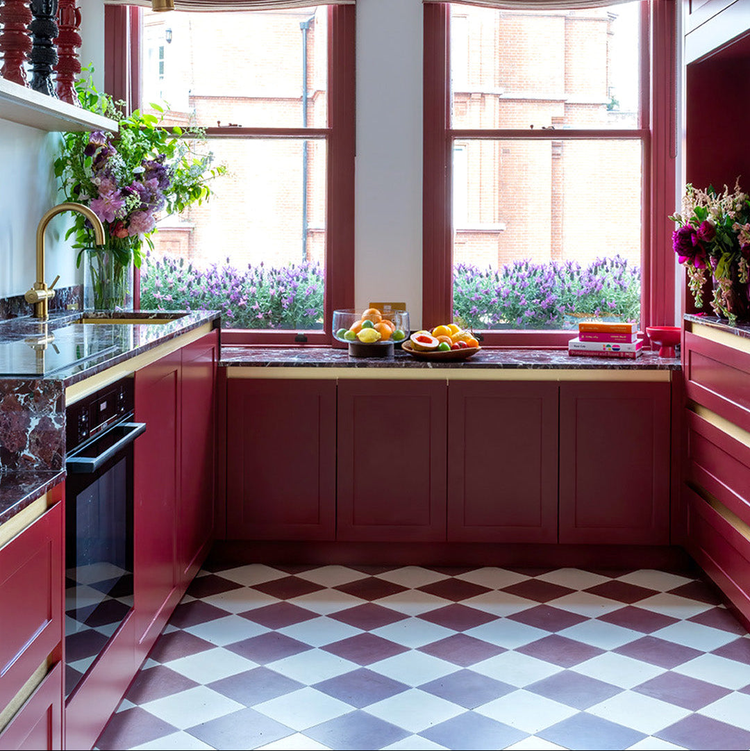 Cement tile featuring a solid aubergine purple-brown color with a smooth matte finish, handcrafted surface, ideal for modern, rustic, or Mediterranean interior flooring and wall décor applications.