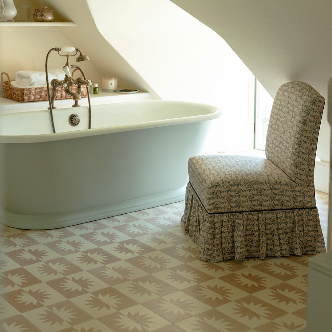 Beige and ivory cement tile featuring a mirrored floral sunburst motif, ideal for modern interiors, decorative wall panels, or contemporary geometric floor pattern designs.