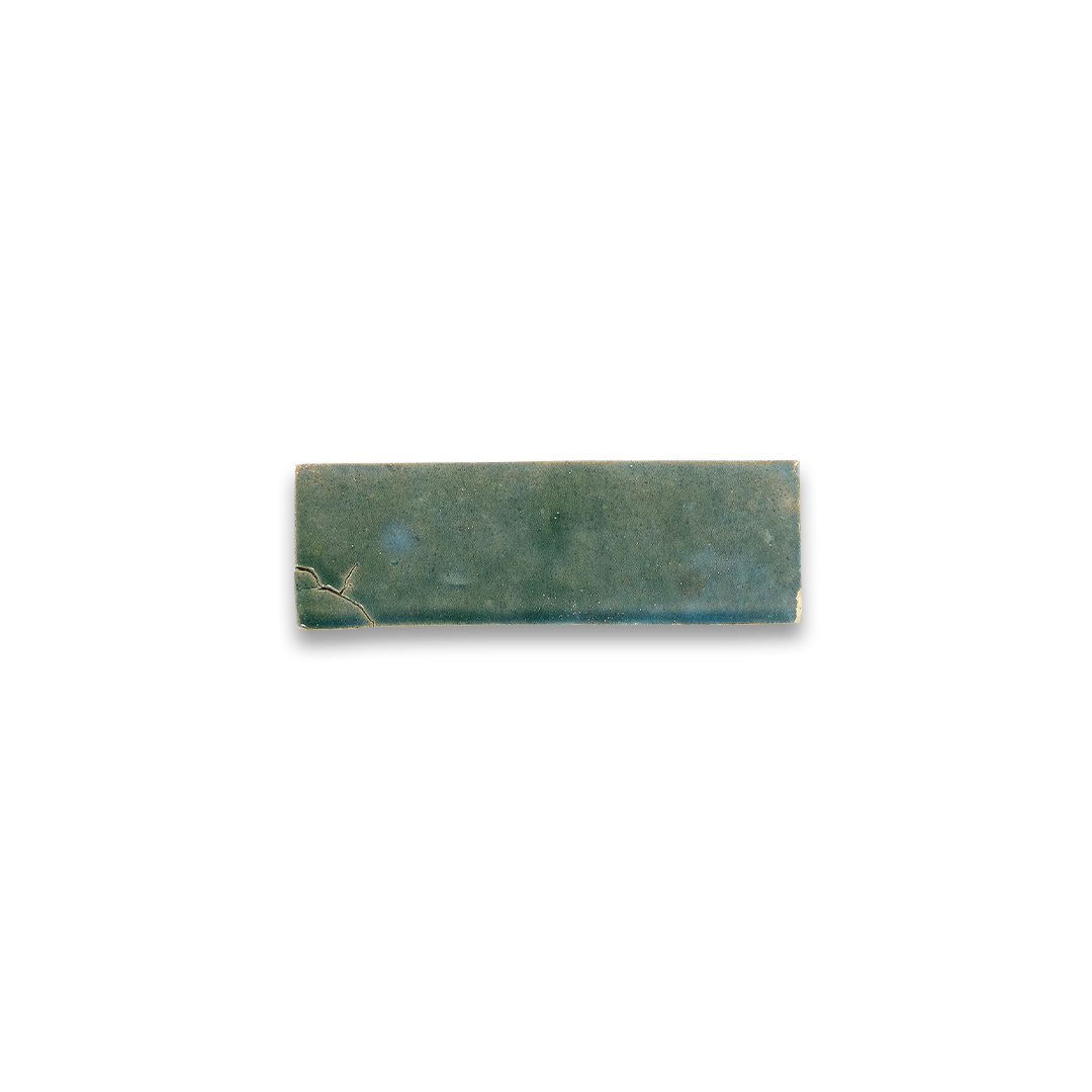 Rectangular greenish-brown stone on a white background