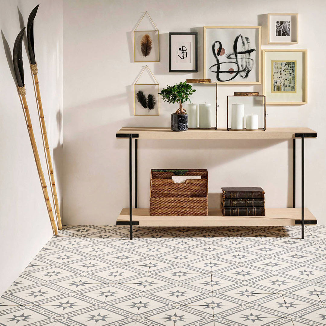 Beige and charcoal cement tile featuring a diagonal geometric pattern with star motifs and bold angular accents, handcrafted matte finish, ideal for Mediterranean-inspired flooring, wall décor, and interior design applications.