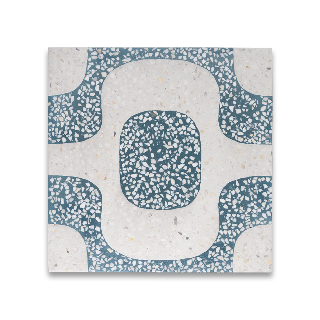 Cement tile featuring a terrazzo pattern with curved geometric shapes in teal blue and white tones, matte finish, ideal for retro, Mediterranean, or modern interior flooring and wall décor applications.