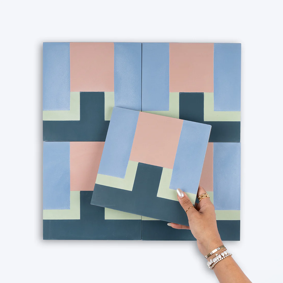 Cement tile featuring a geometric block pattern in pastel pink, sky blue, mint green, and deep teal tones, matte finish, ideal for modern, retro, or Mediterranean interior flooring and wall décor applications.