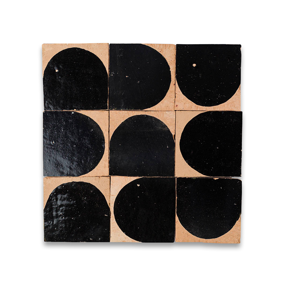 Square tile with black semi-circle pattern on a beige background
