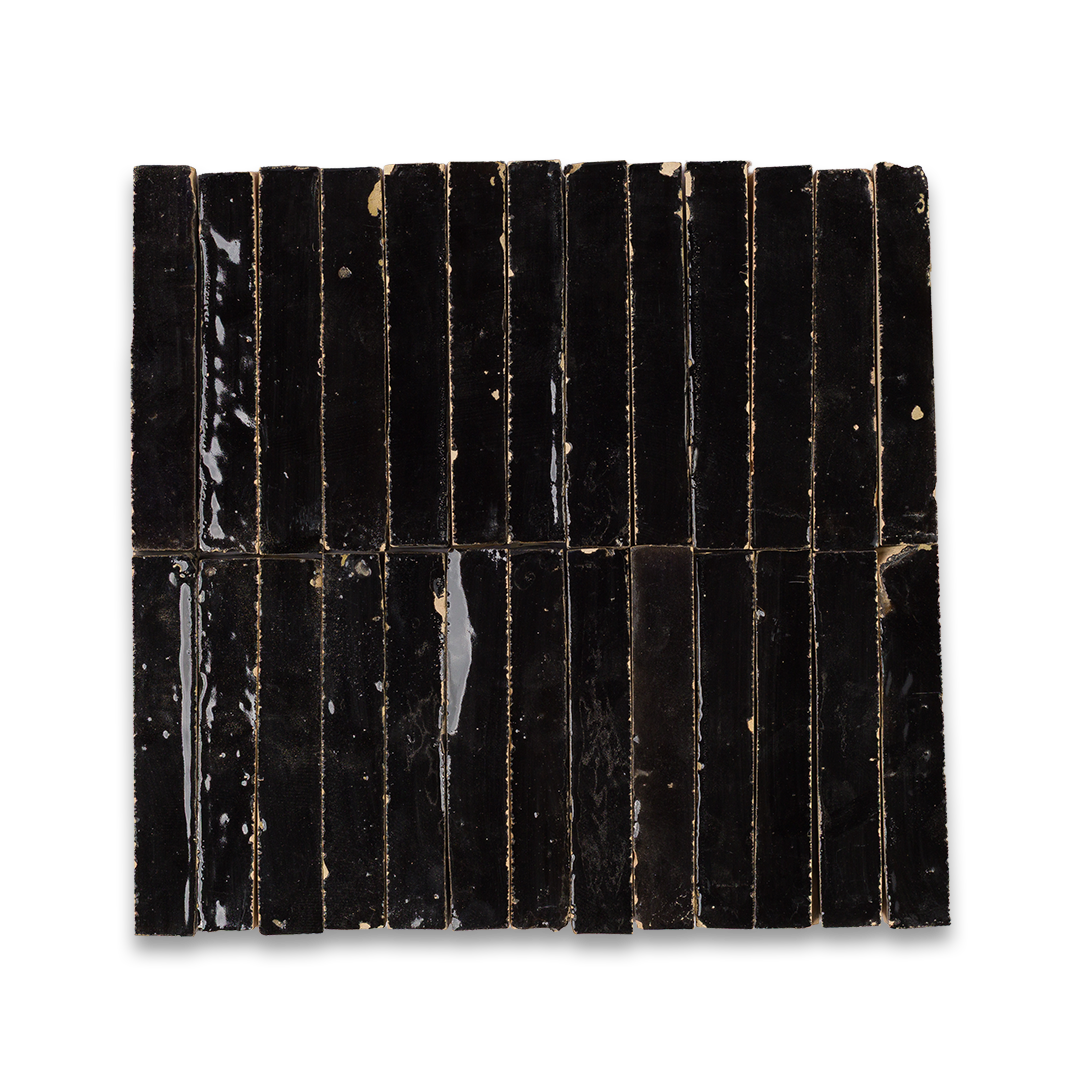 Black rectangular tiles with ribbed texture on a white background