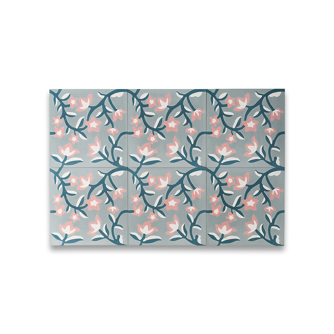 Cement tile featuring a floral pattern with pink and white blossoms on dark teal vines over a soft gray background, matte finish, ideal for vintage, bohemian, or Mediterranean interiors.