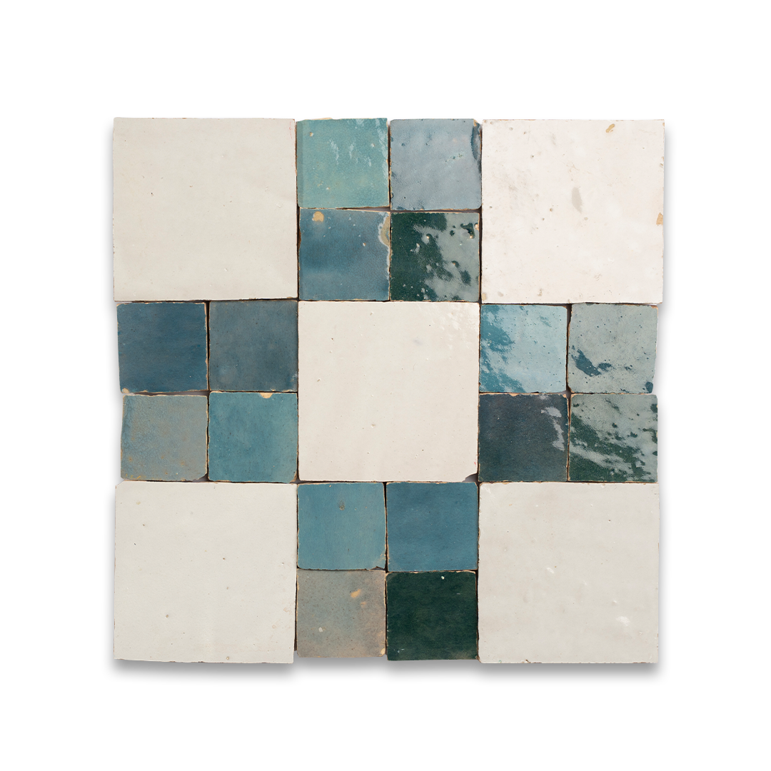 Mosaic pattern of square tiles in blue and white on a white background