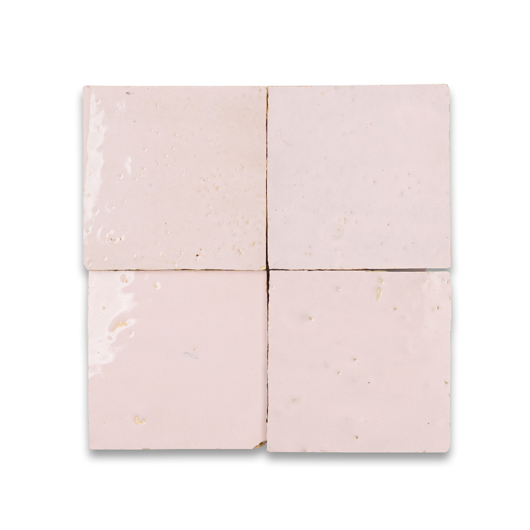 Four pink tiles arranged in a grid on a white background