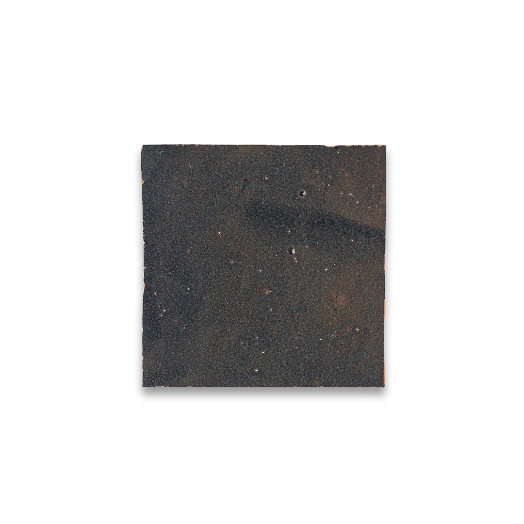 Square piece of dark material on a white background