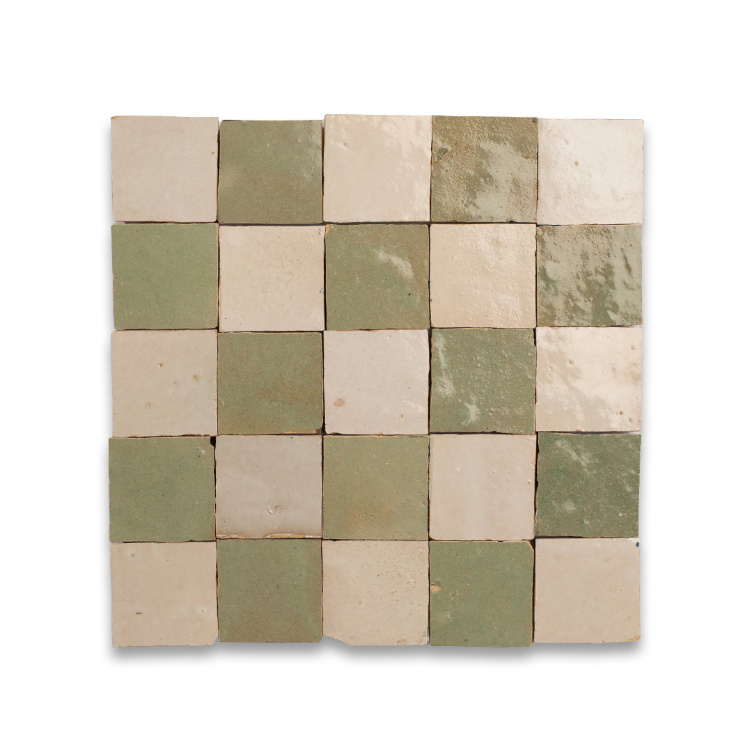 Square tile pattern with green and beige tiles on a white background