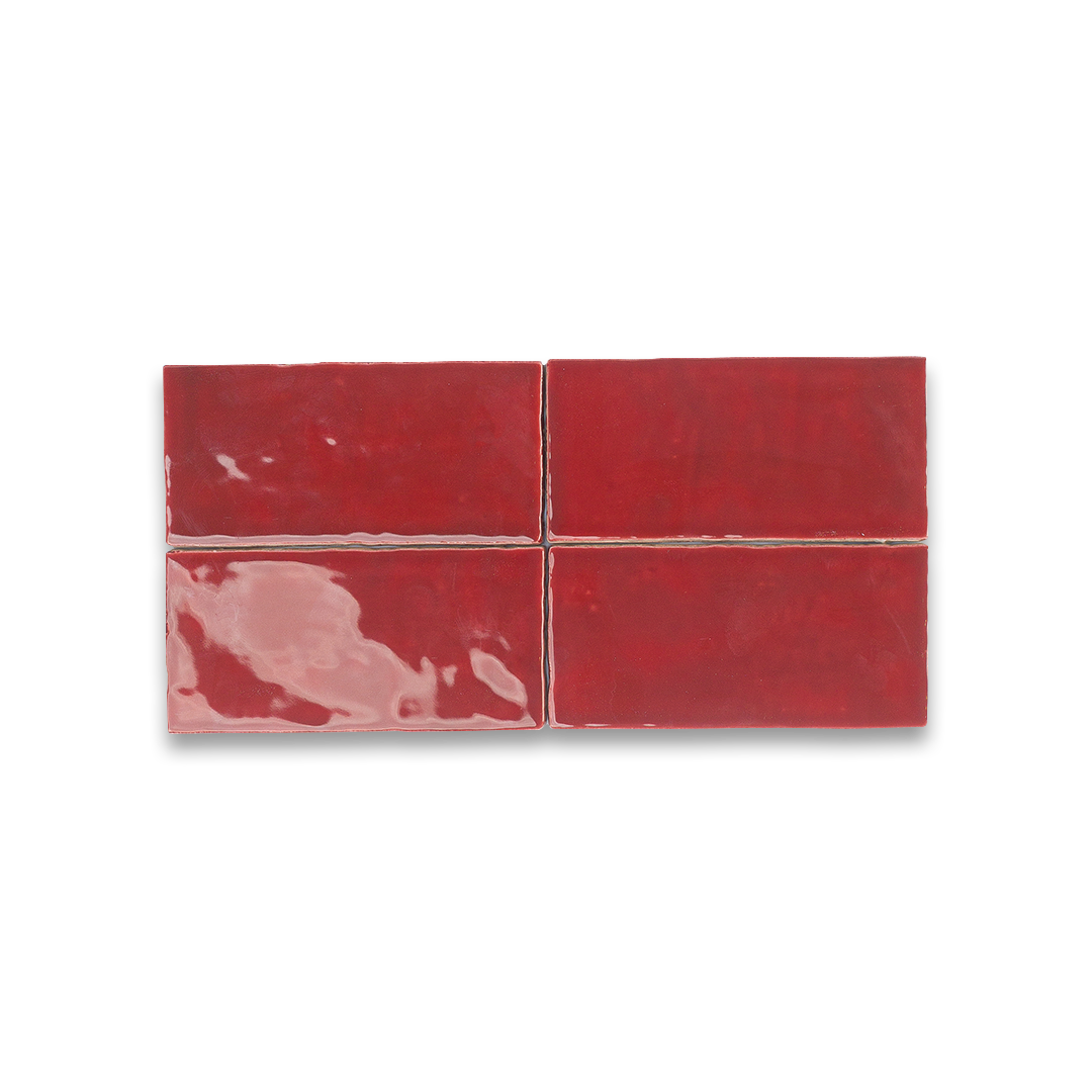Red ceramic tile with a glossy finish on a white background