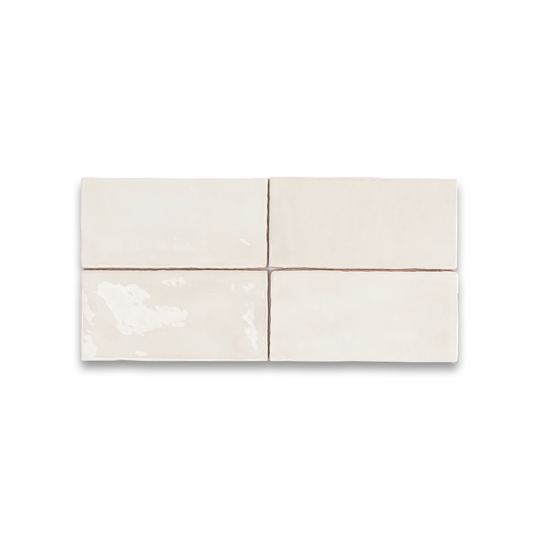 Set of four white ceramic tiles on a white background