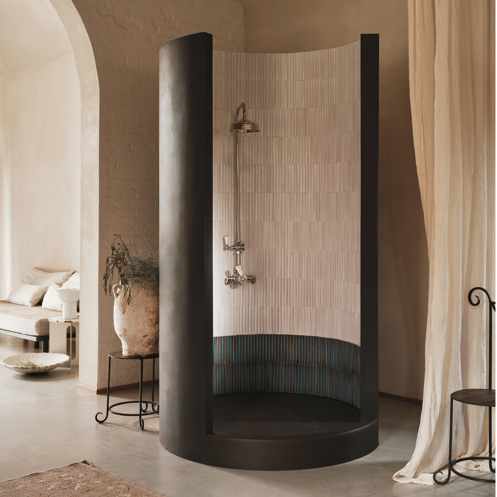 Modern shower enclosure in a stylish bathroom setting with beige walls and decor.