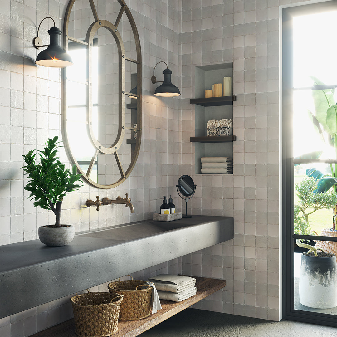 Modern bathroom interior with tiled walls, a sink, and decorative elements.