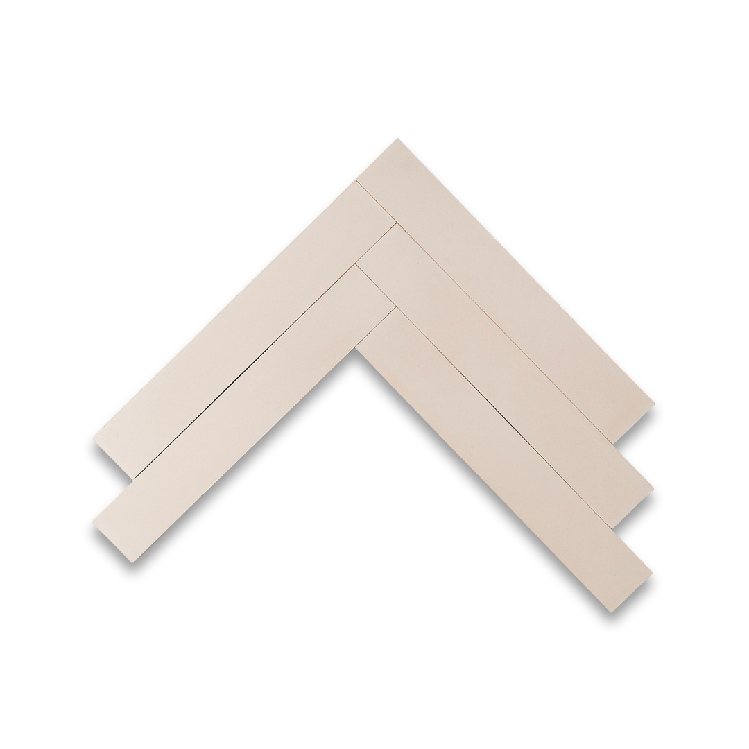 Rectangular cream tiles arranged in a herringbone pattern, showcasing a smooth matte finish and minimalist design ideal for modern kitchens, bathrooms, and feature walls.