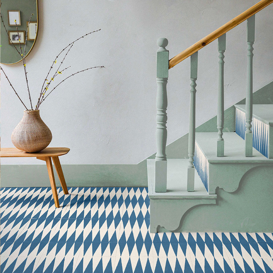 Cement tile featuring alternating deep teal blue and white elongated triangular patterns, matte finish, ideal for modern, geometric, or Mediterranean interior flooring and wall décor applications.