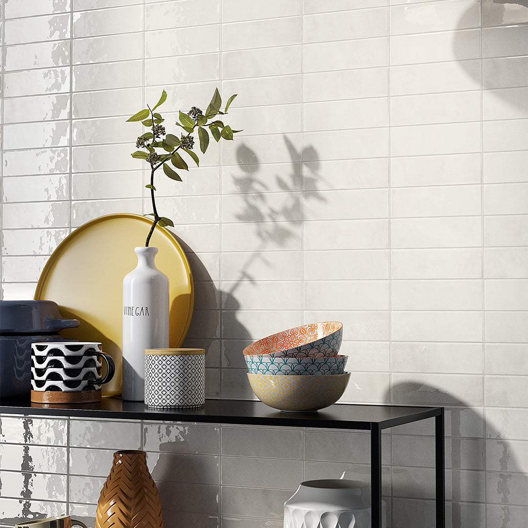 White ceramic bathroom tiles arranged in clean grid pattern, ideal for flooring, backsplash, or shower walls.