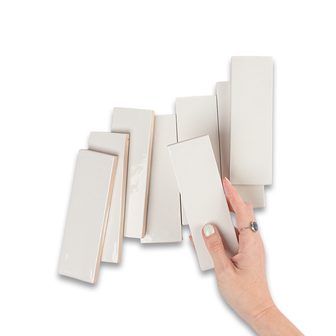 White ceramic bathroom tiles arranged in clean grid pattern, ideal for flooring, backsplash, or shower walls.