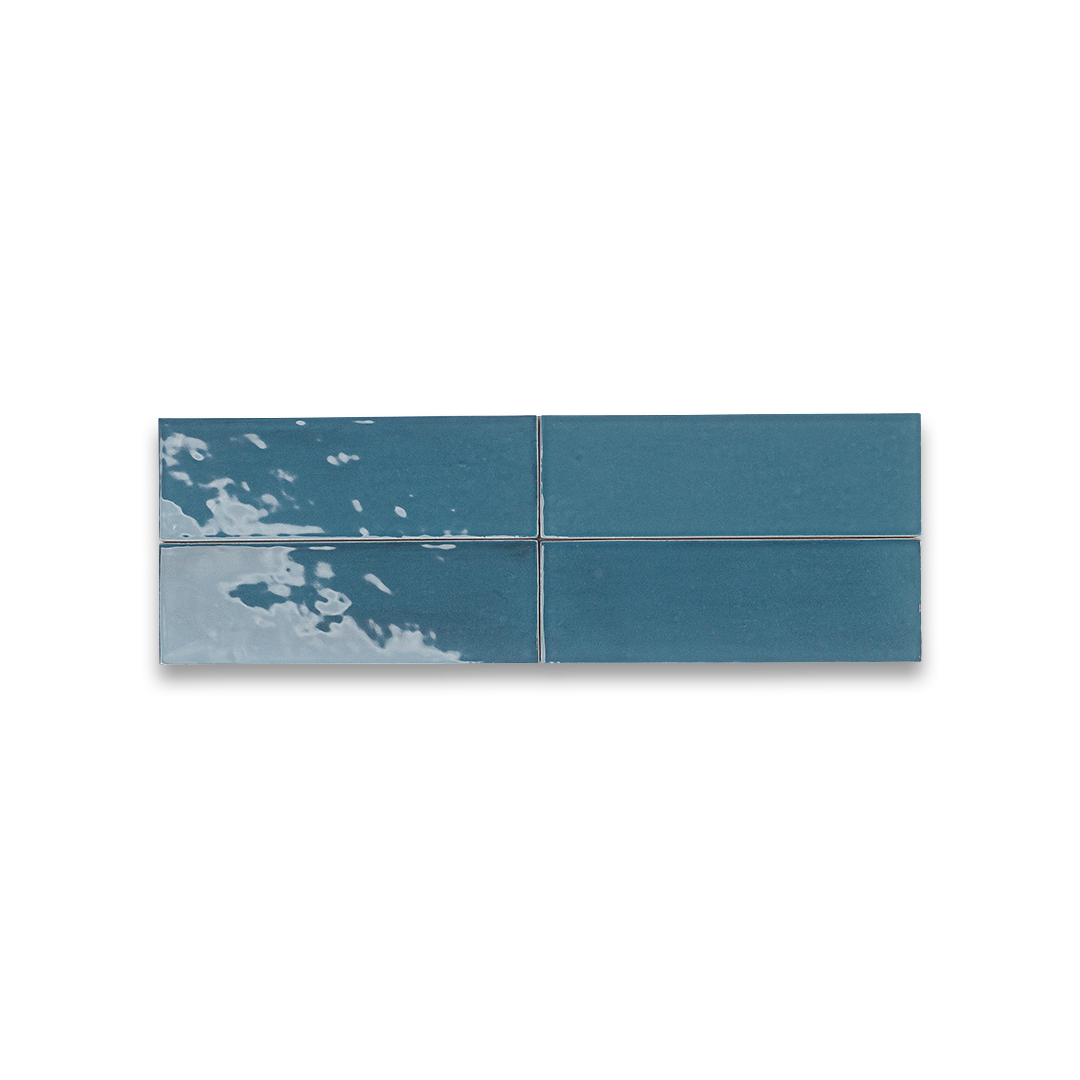 Set of four blue ceramic tiles on a white background