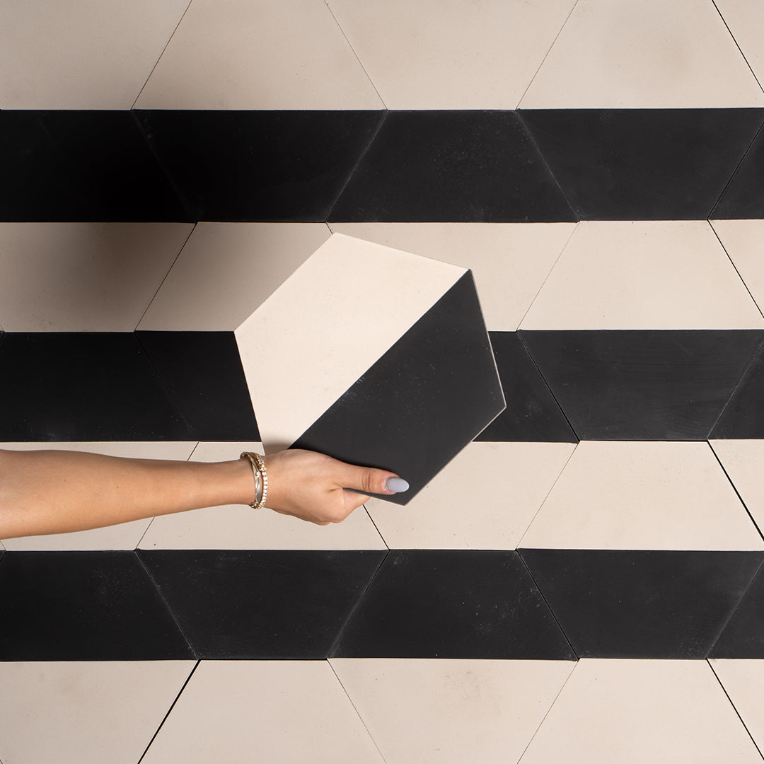 Hexagonal tile featuring a smooth cream upper half and curved black lower section, ideal for modern interiors, geometric wall art, or minimalist floor pattern designs.