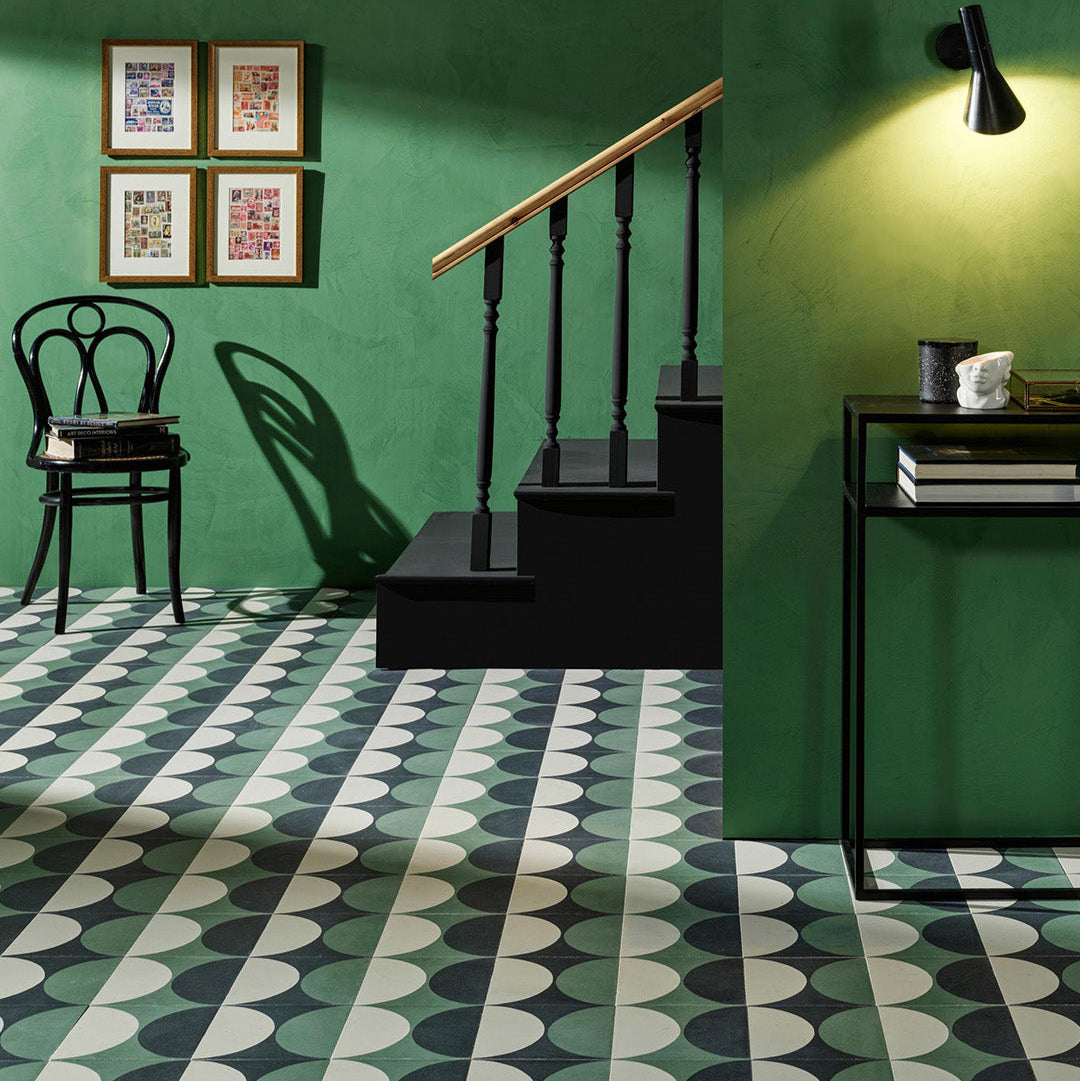 A geometric circular pattern in green, black, and off-white tones, matte finish, ideal for modern, retro, or contemporary interior flooring and wall décor applications.