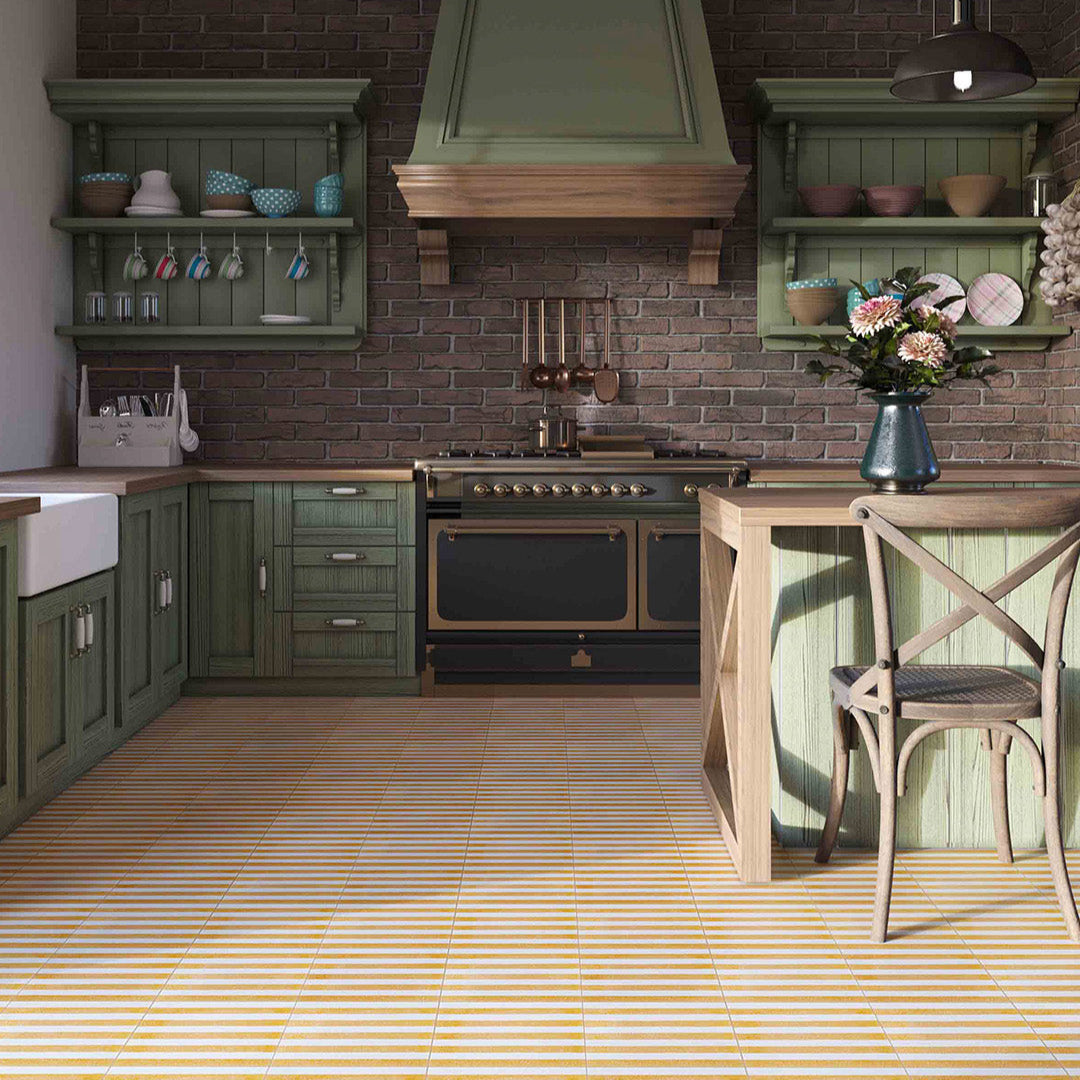 Modern kitchen with green cabinets, wooden floor, and decorative elements.