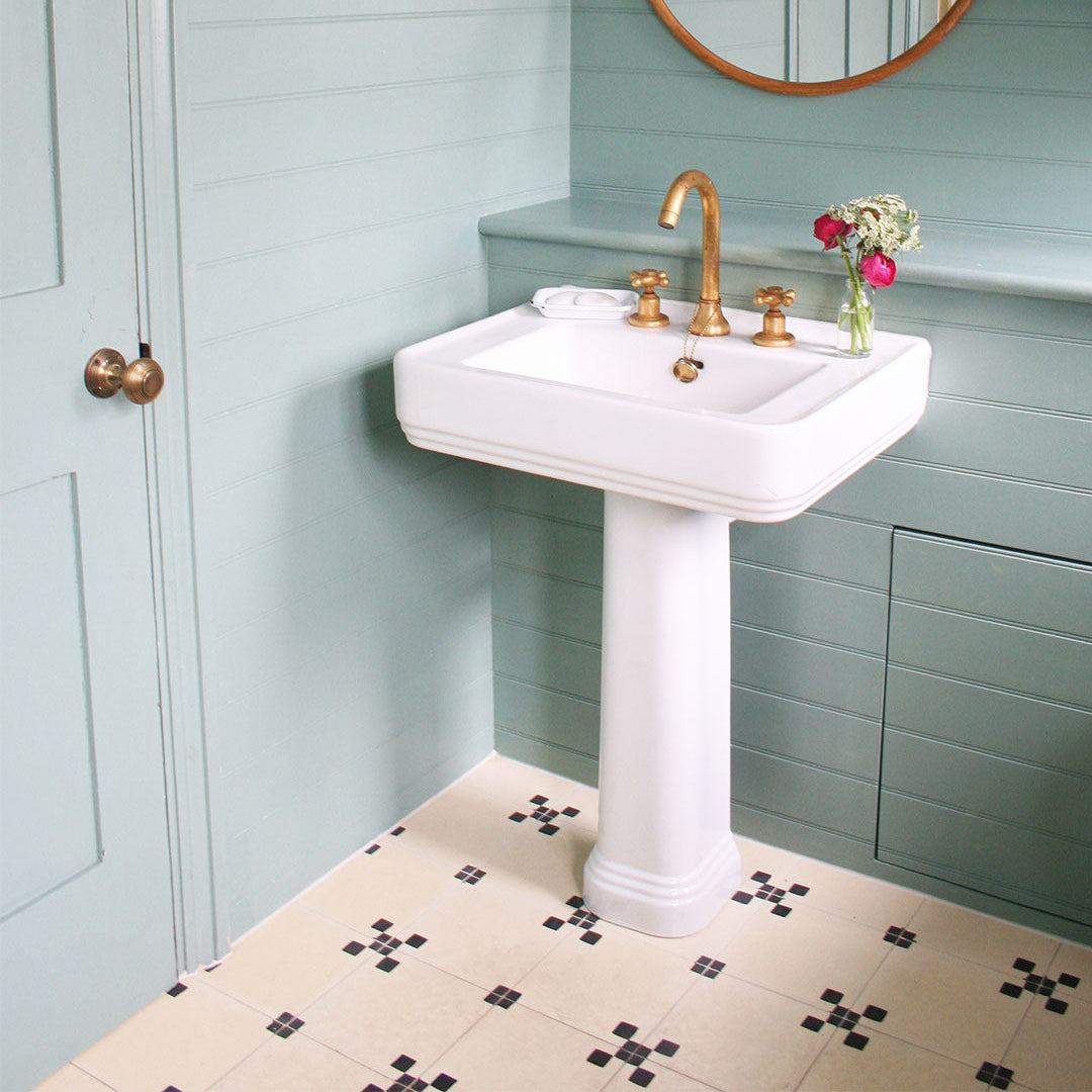 Minimalist floor tile featuring a cream base with four black corner squares, ideal for modern interiors, geometric wall patterns, or vintage-inspired flooring designs.