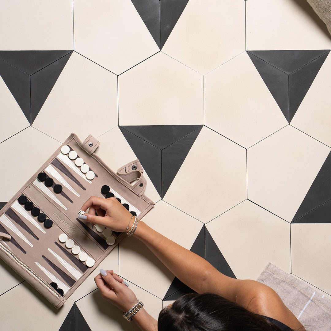 Modern hexagonal tile featuring a matte cream surface with a bold black edge accent, ideal for geometric wall patterns, minimalist flooring, or contemporary interior designs.