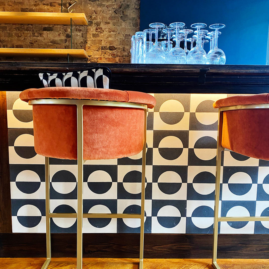 A bold geometric circle pattern in black and off-white tones, matte finish, square shape, ideal for modern, minimalist, or contemporary flooring and wall décor applications.