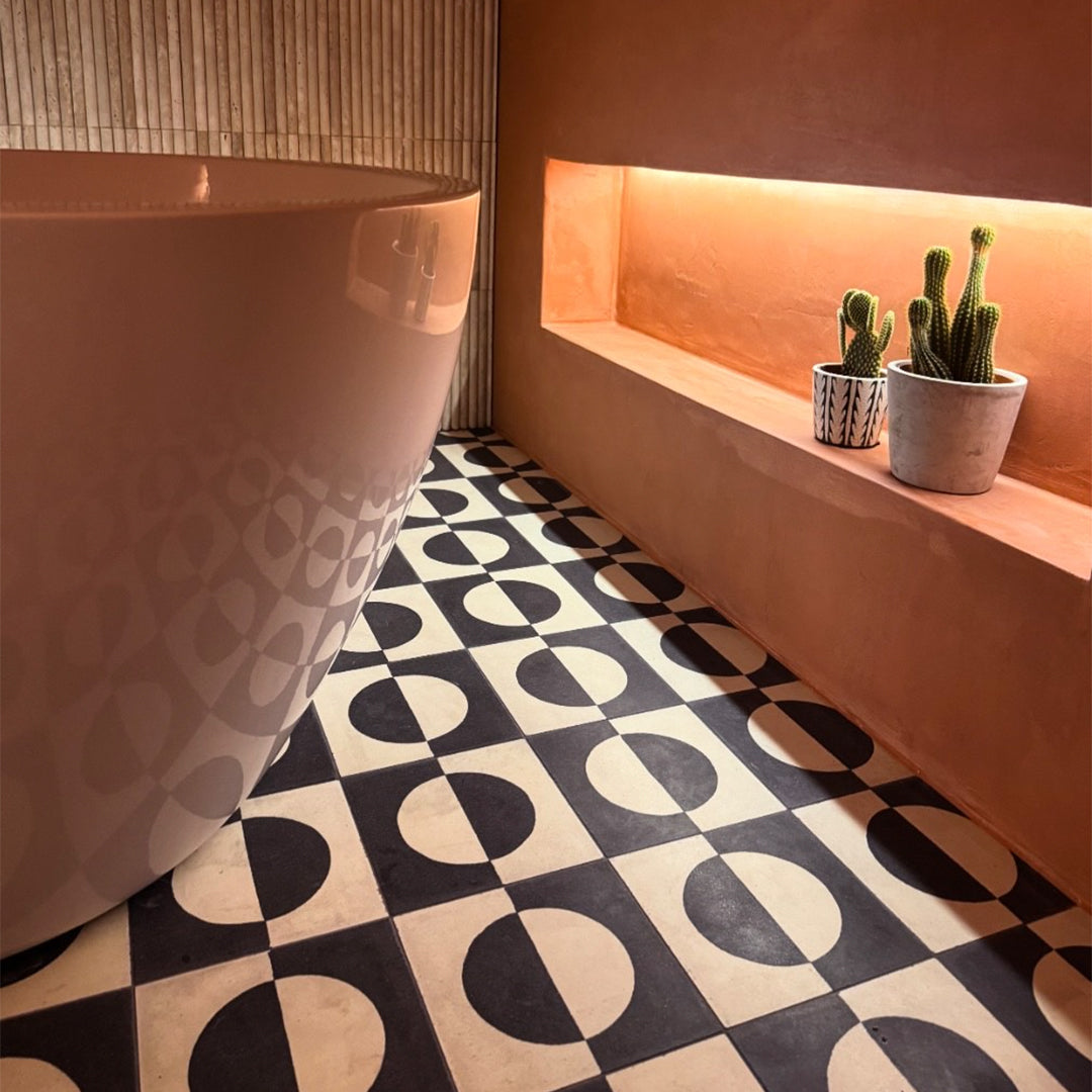 A bold geometric circle pattern in black and off-white tones, matte finish, square shape, ideal for modern, minimalist, or contemporary flooring and wall décor applications.