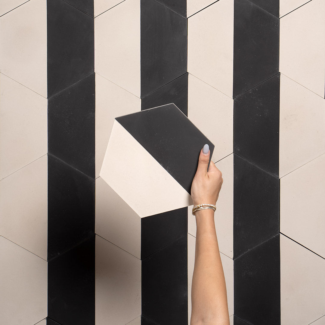 Geometric hexagonal tile featuring a bold black upper section and soft cream lower half, ideal for modern interiors, 3D wall illusions, or contemporary floor patterns.