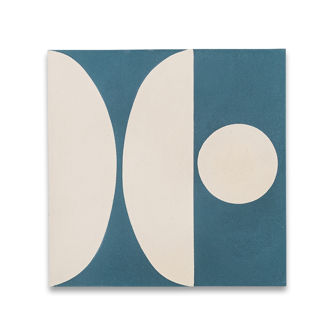 Cement tile featuring abstract geometric shapes in deep teal blue and white, with curved and circular patterns, matte finish, ideal for modern, retro, or mid-century interior flooring and wall décor applications.