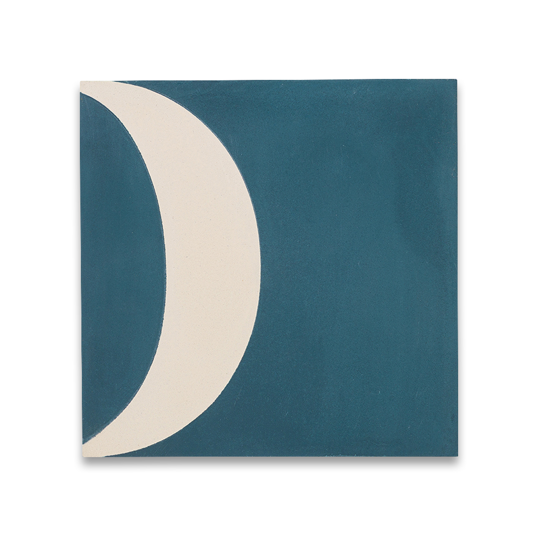 Cement tile featuring abstract geometric shapes in deep teal blue and white, with curved and circular patterns, matte finish, ideal for modern, retro, or mid-century interior flooring and wall décor applications.