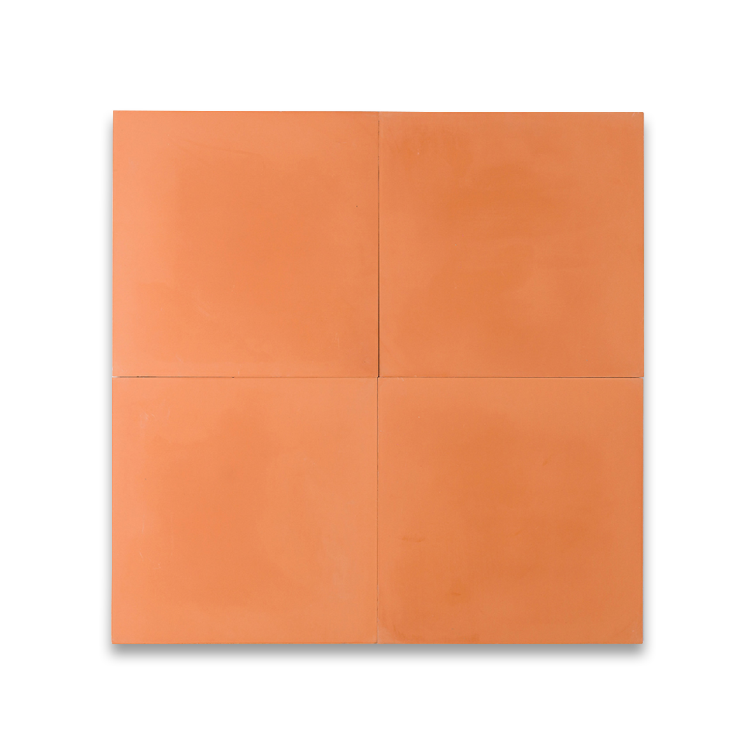 Cement tile featuring a solid peach color with a smooth matte finish, handcrafted texture, ideal for Mediterranean, tropical, or contemporary interior flooring and wall décor applications.