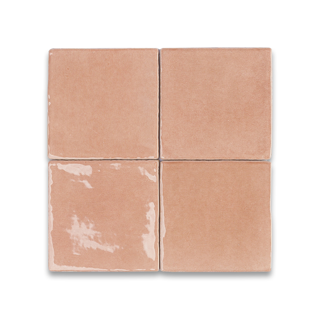 Set of four square tiles with a beige color on a white background