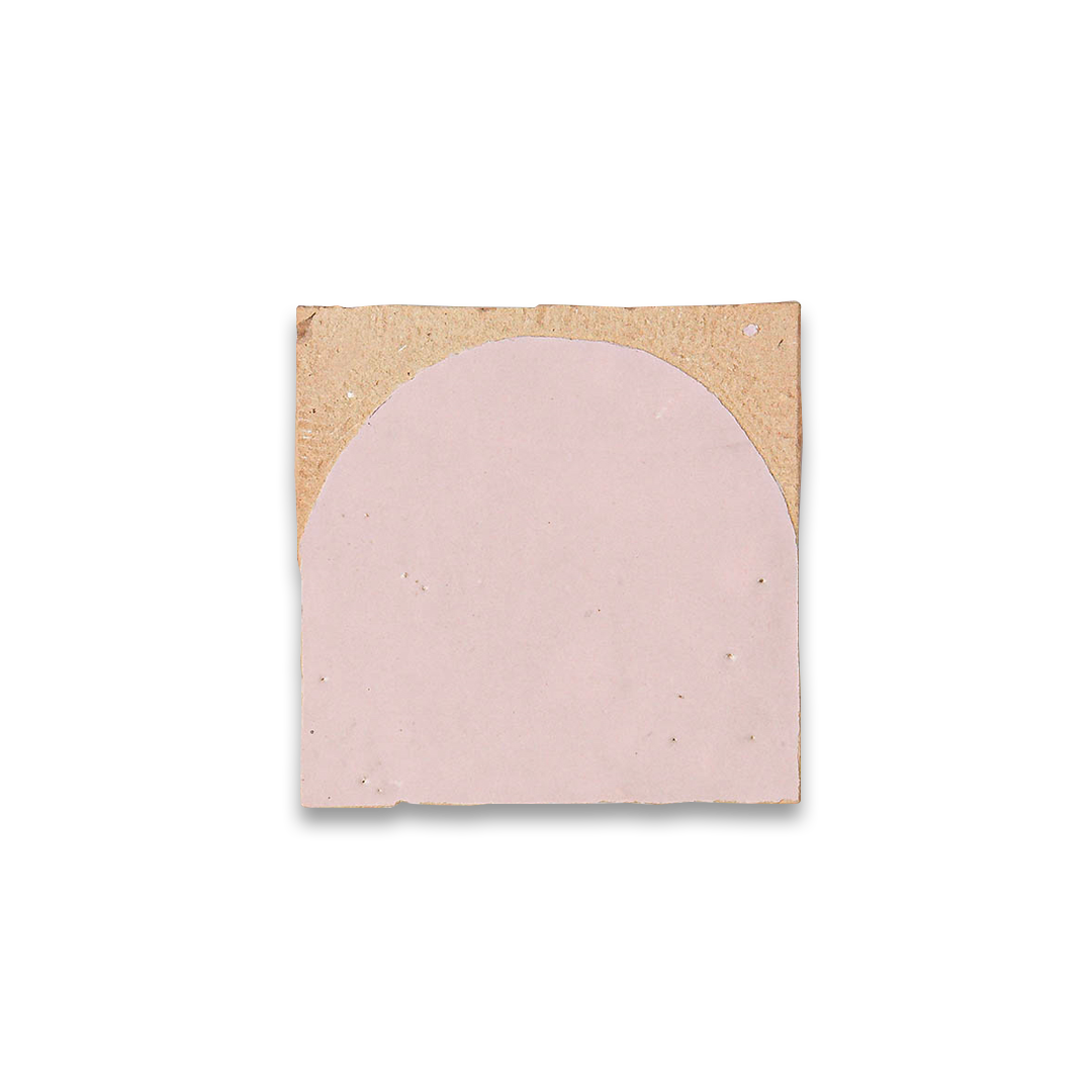 Pink arch-shaped wall art on a wooden board with a white background