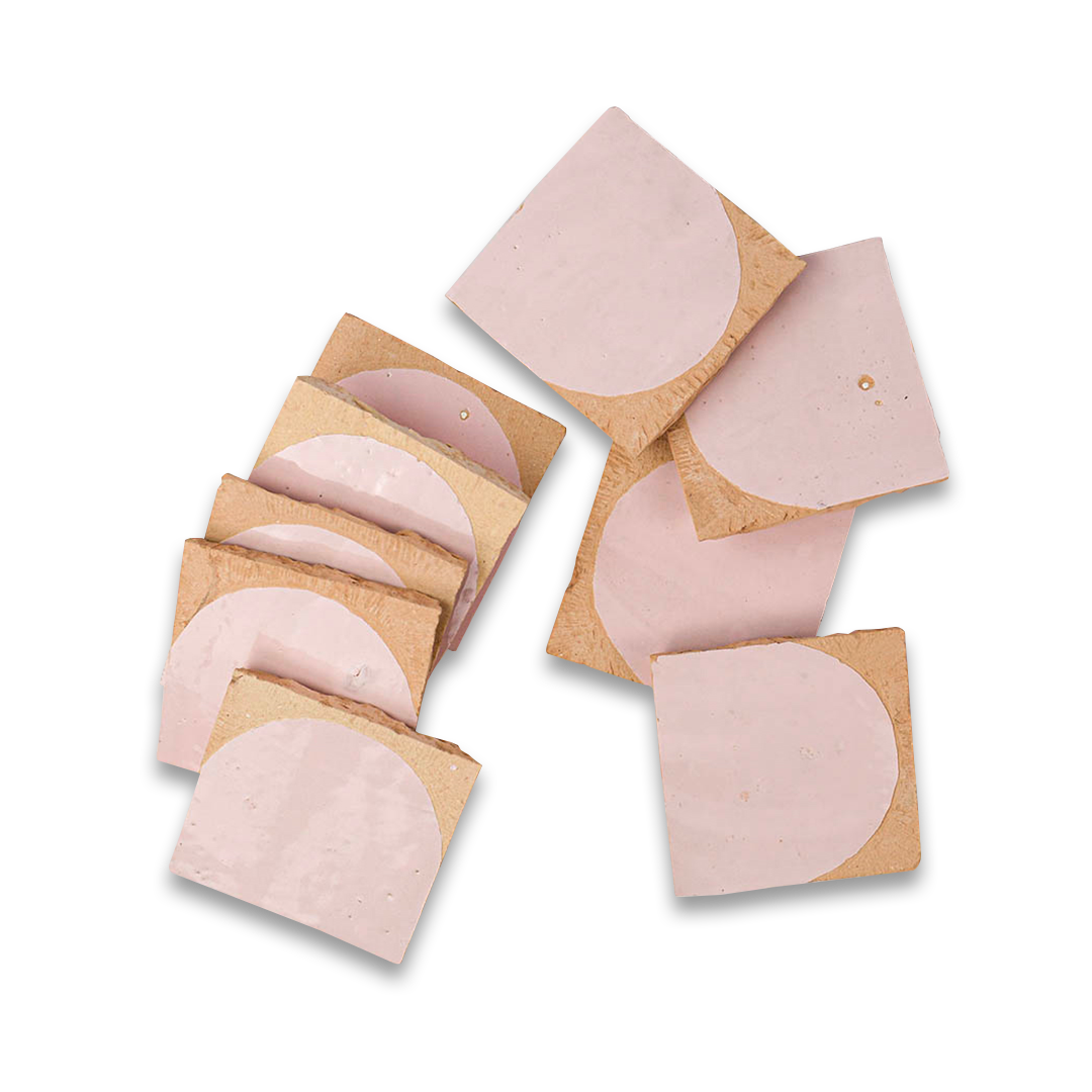 Set of pink silicone pasties on cardboard packaging against a white background