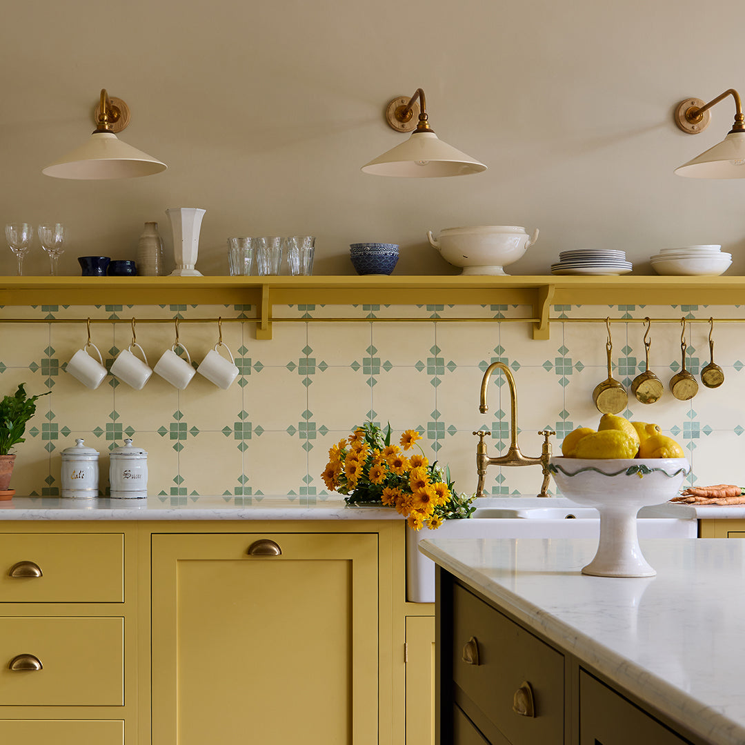 Contemporary cement tile featuring a soft beige base with subtle sage green corner accents, ideal for minimalist interiors, geometric wall layouts, or modern floor designs.