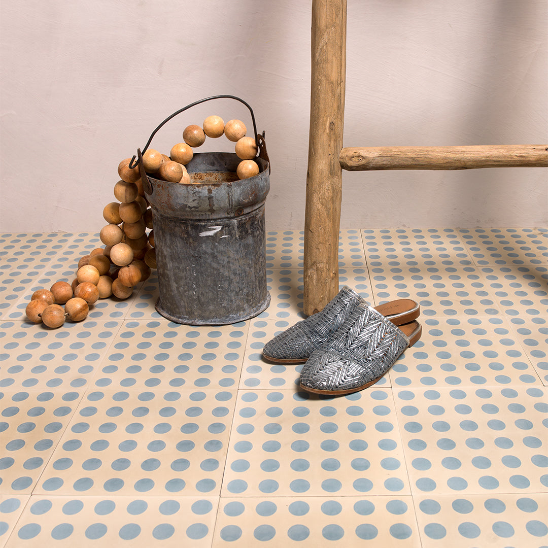Beige cement tile featuring a repeating blue polka dot pattern, handcrafted matte finish, playful geometric design ideal for retro-inspired flooring, wall décor, and contemporary interior applications.