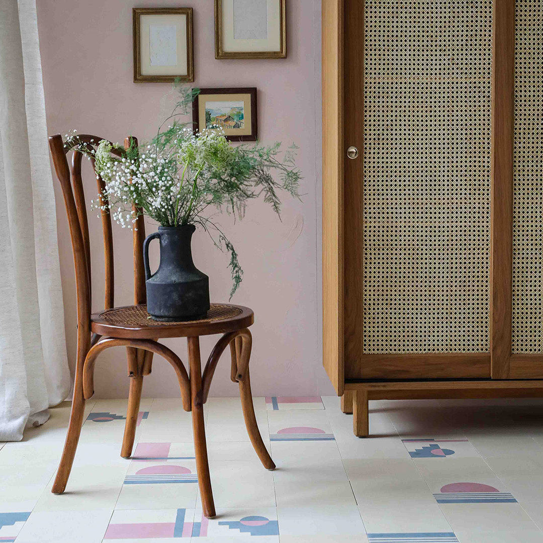 Sunset Stripes cement tile featuring a large pink semicircle sun above soft blue horizontal lines on a cream base, matte finish, ideal for coastal, bohemian, or modern interior wall and floor décor.