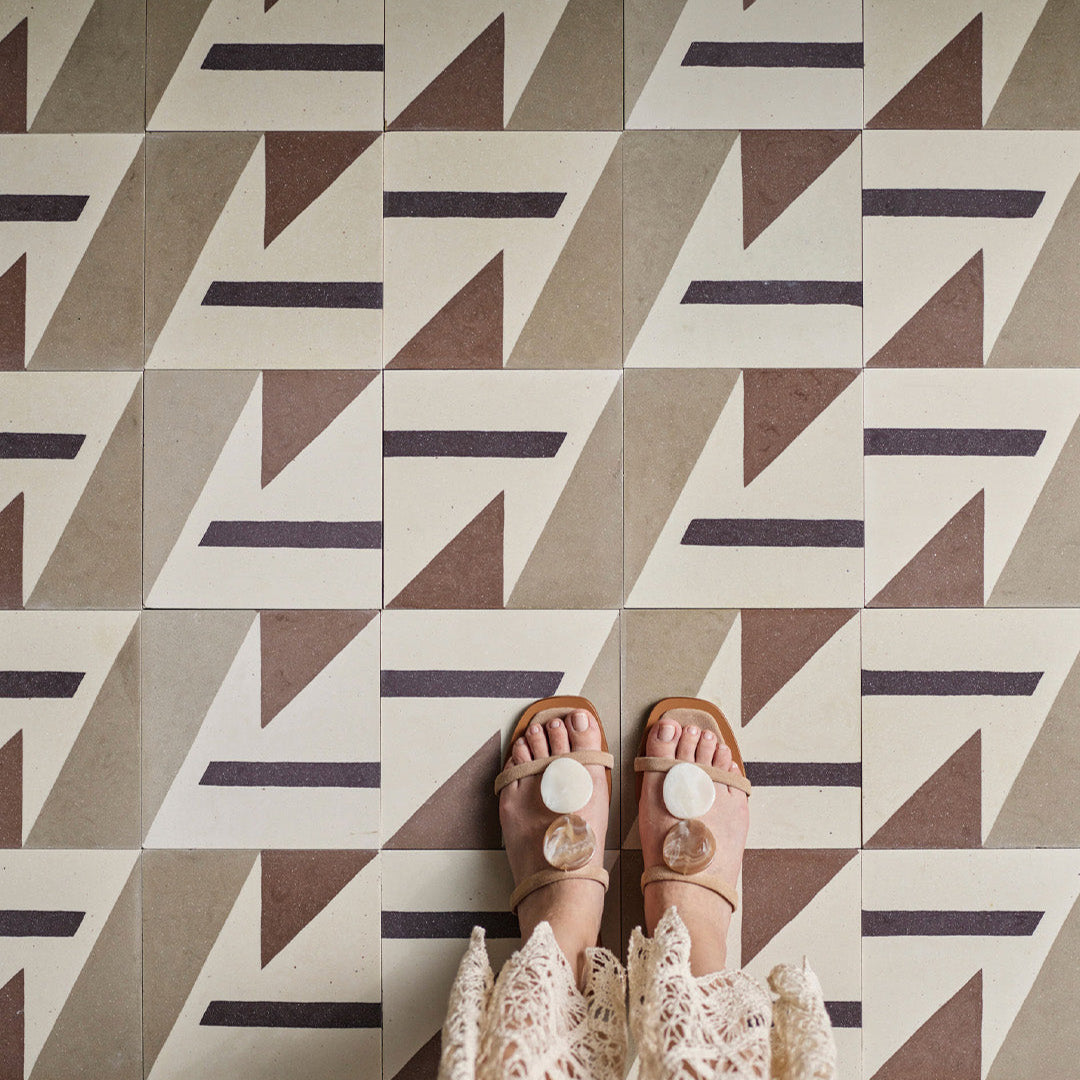 Beige and brown cement tile featuring bold geometric triangles and angular shapes with a matte finish, ideal for modern interiors, accent walls, or contemporary floor patterns.