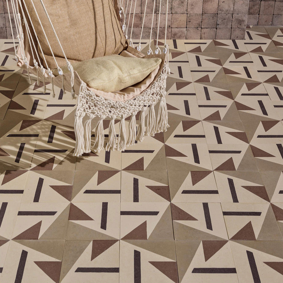 Beige and brown cement tile featuring bold geometric triangles and angular shapes with a matte finish, ideal for modern interiors, accent walls, or contemporary floor patterns.