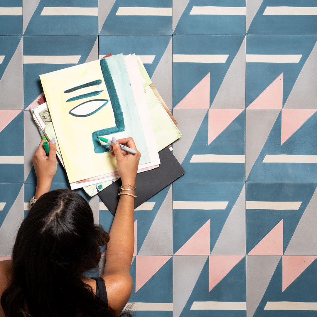 Cement tile featuring geometric shapes in teal blue, blush pink, beige, and gray tones, matte finish, ideal for modern, abstract, or contemporary interior flooring and wall décor applications.