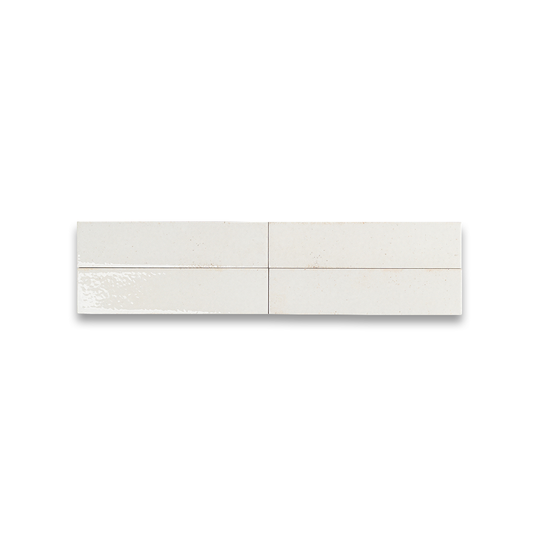 Glossy white ceramic bathroom tiles with subtle speckled texture, perfect for modern flooring, backsplash, or shower walls