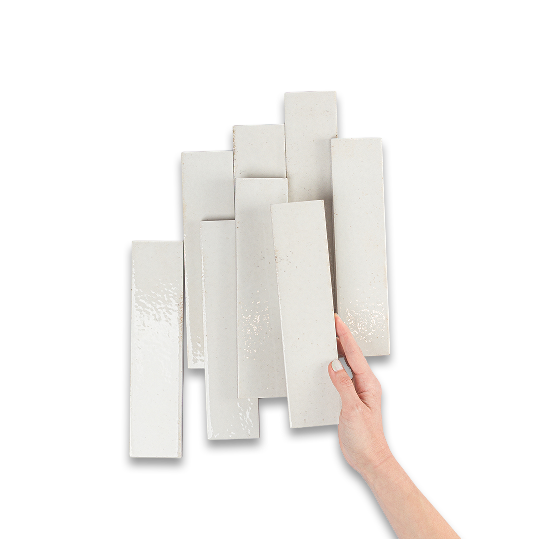 Glossy white ceramic bathroom tiles with subtle speckled texture, perfect for modern flooring, backsplash, or shower walls