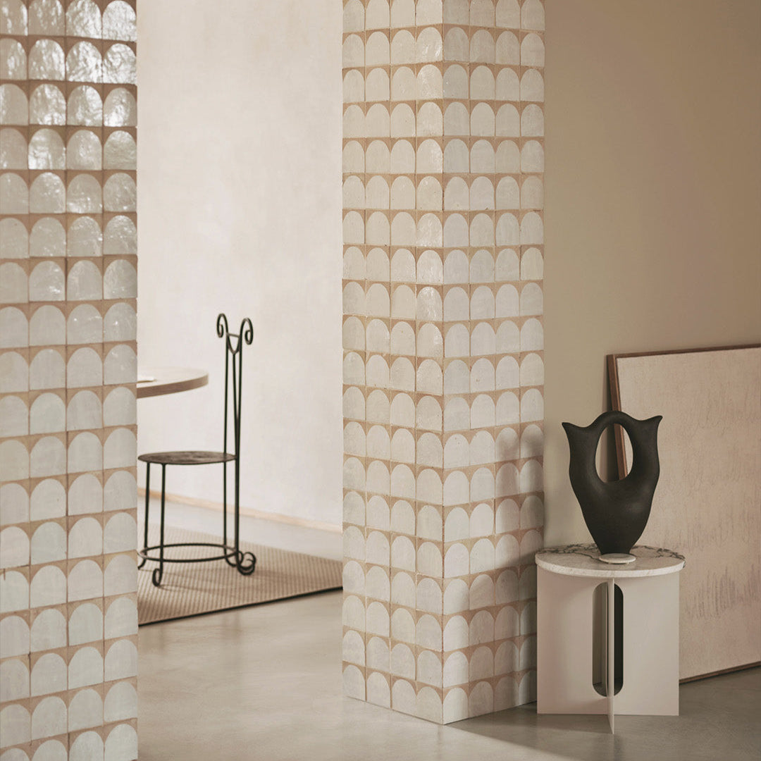 Decorative wall panels with a geometric pattern in a room setting.