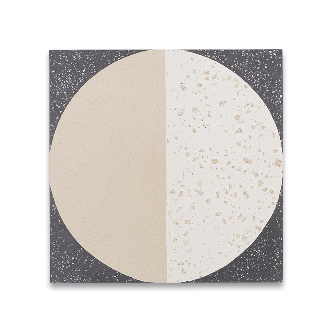 Square tile with a circular design split between dark gray and beige terrazzo patterns. 