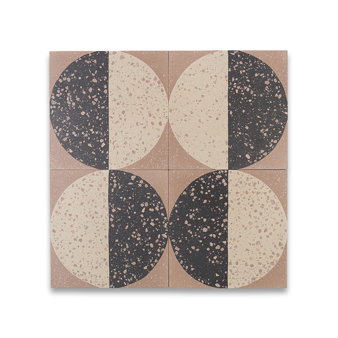 A square cement tile featuring a large circle divided into black and beige halves with terrazzo speckles, set against a warm brown background for a modern geometric look.