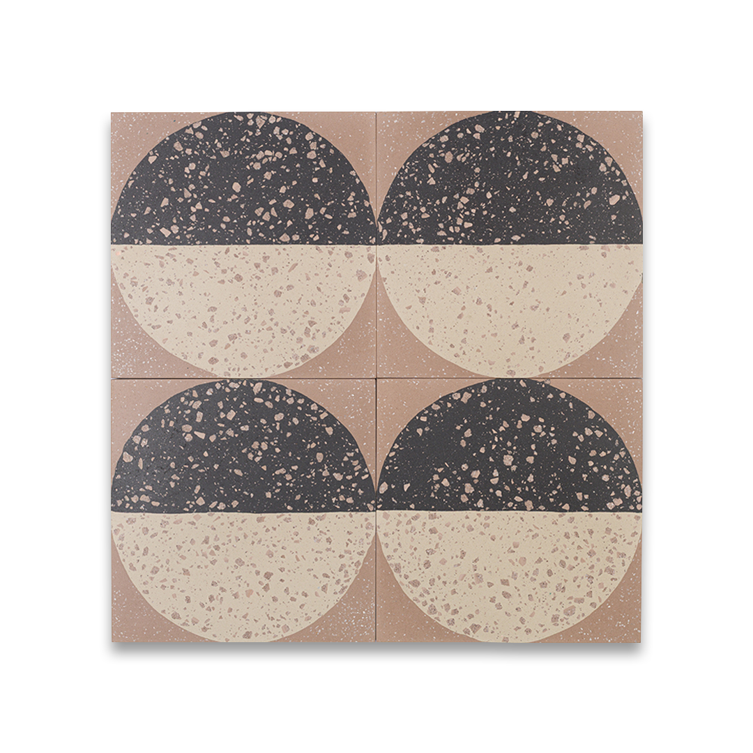 A square cement tile featuring a large circle divided into black and beige halves with terrazzo speckles, set against a warm brown background for a modern geometric look.