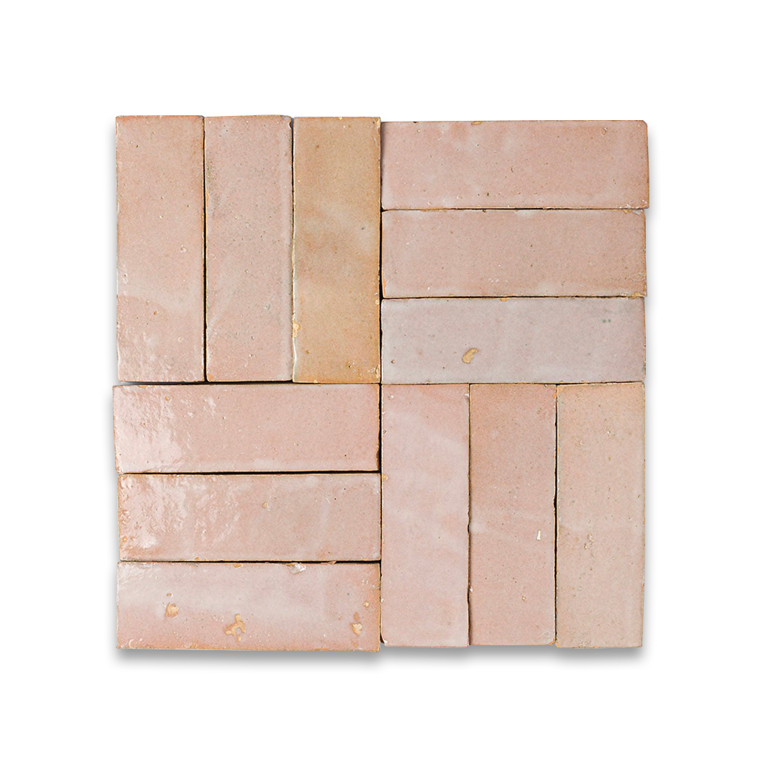 Square arrangement of stone tiles in various shades of pink and beige on a white background